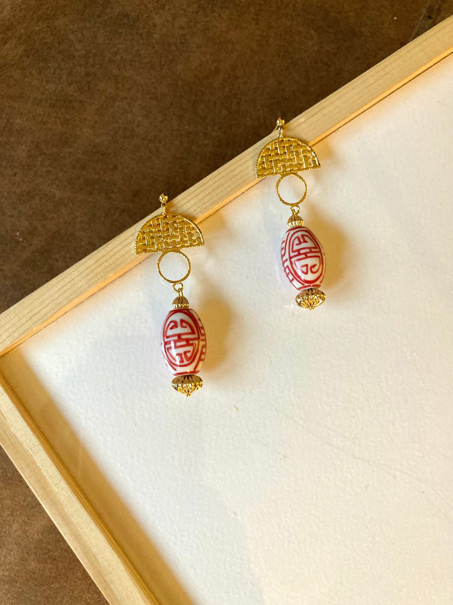 Statement Modern Design Golden Stud Earrings with Hand Painted Ceramic Ancient Character of Long-Life Beads