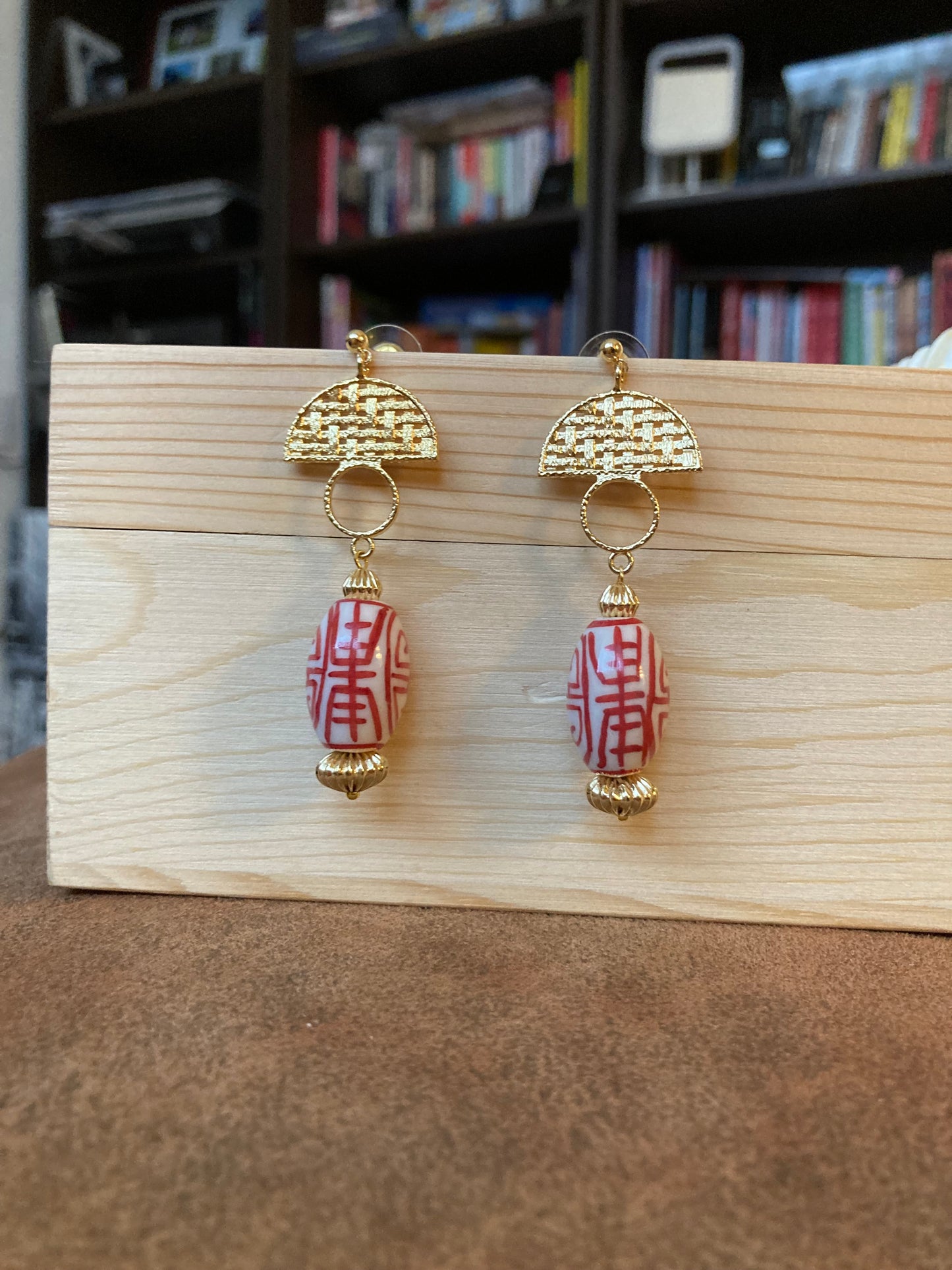 Statement Modern Design Golden Stud Earrings with Hand Painted Ceramic Ancient Character of Long-Life Beads