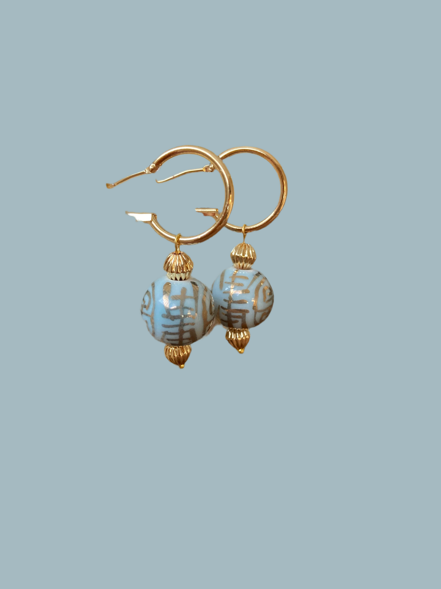 Esperanza• Modern Design Golden Huggies Earrings with Hand Painted Ancient Character of Long-Life Ceramic Beads